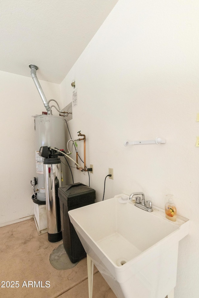 washroom featuring sink and water heater