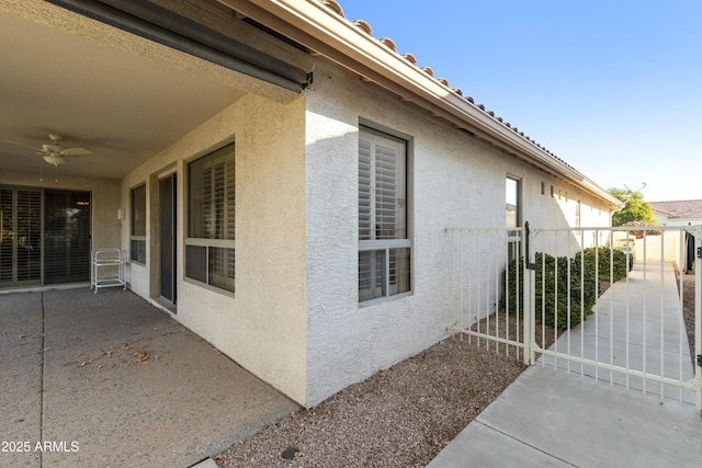 view of property exterior featuring ceiling fan