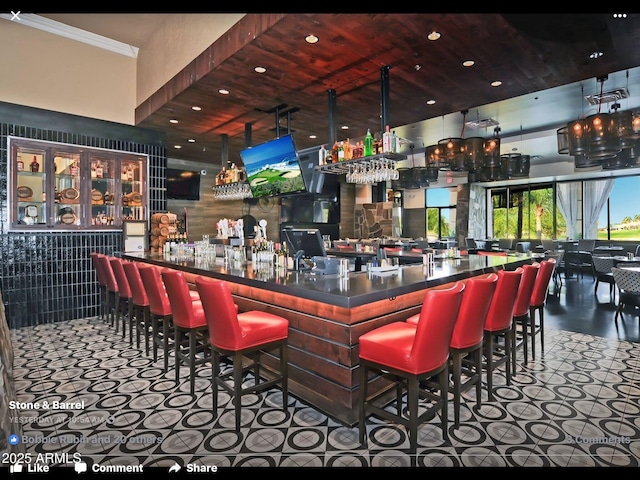 bar with wooden ceiling and tile patterned flooring