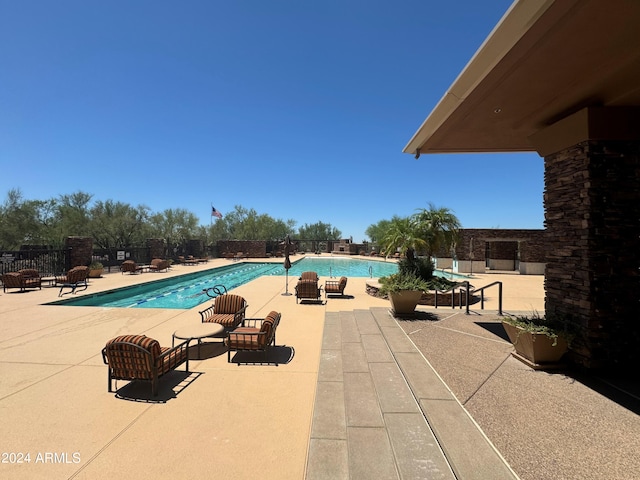 view of swimming pool featuring a patio area