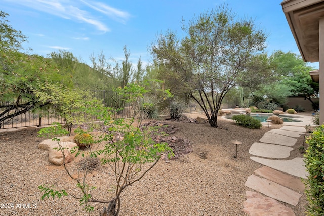 view of yard featuring a fenced in pool and a fenced backyard