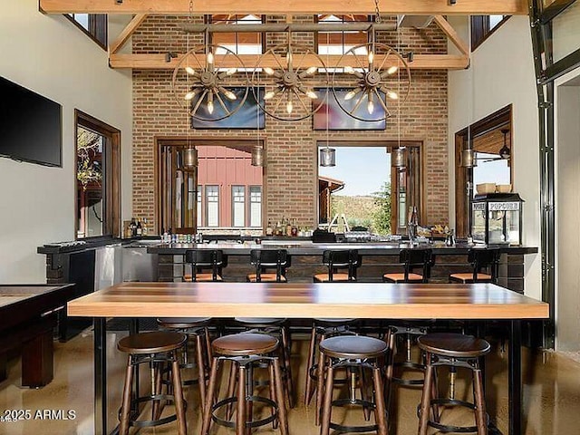 bar with brick wall and a towering ceiling