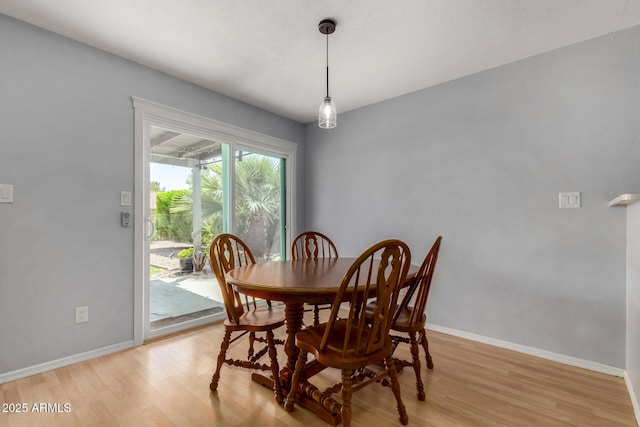 5601 W Whitten St, Chandler, AZ 85226 - dining area with baseboards and light wood-type flooring