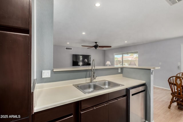 5601 W Whitten St, Chandler, AZ 85226 - kitchen with a sink, light countertops, a ceiling fan, and dark brown cabinets