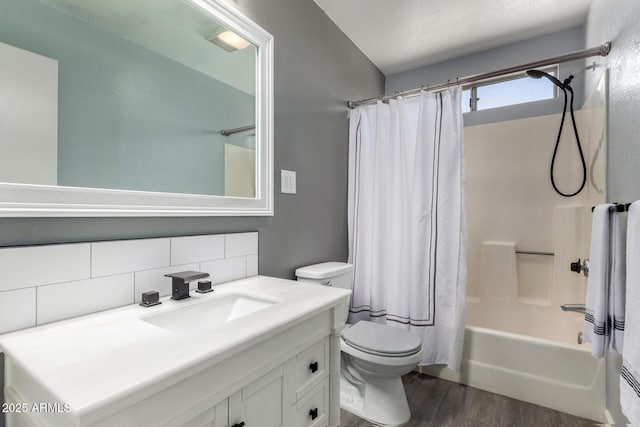 5601 W Whitten St, Chandler, AZ 85226 - full bathroom with decorative backsplash, wood finished floors, vanity, toilet, and shower / bath combo with shower curtain