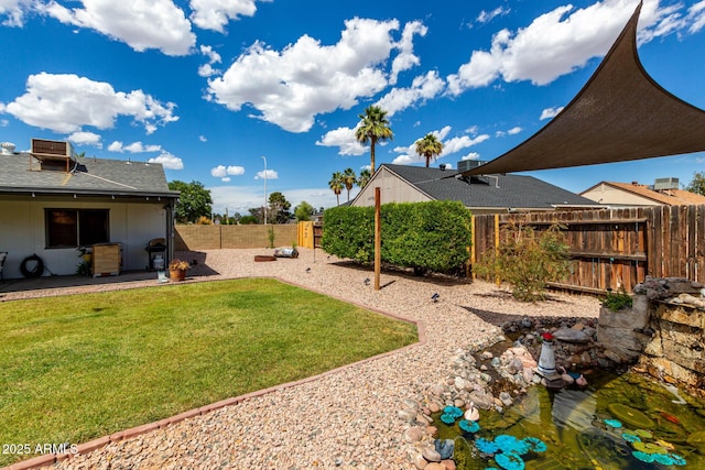5601 W Whitten St, Chandler, AZ 85226 - view of yard featuring a fenced backyard and a patio area
