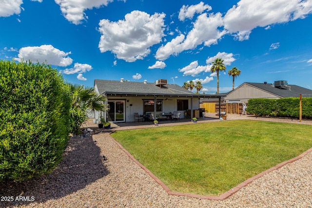 5601 W Whitten St, Chandler, AZ 85226 - back of property featuring a lawn, a ceiling fan, fence private yard, and a patio