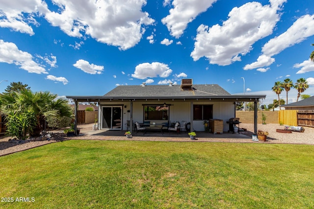 5601 W Whitten St, Chandler, AZ 85226 - back of property with a lawn, fence, outdoor lounge area, and a patio area