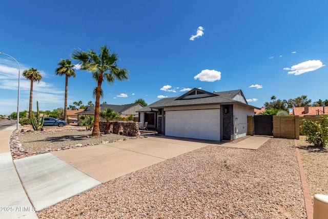 5601 W Whitten St, Chandler, AZ 85226 - ranch-style house featuring a garage, fence, a gate, roof mounted solar panels, and concrete driveway