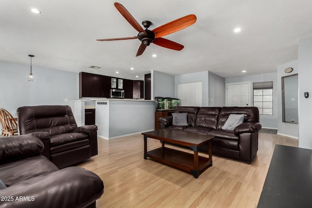 5601 W Whitten St, Chandler, AZ 85226 - living area featuring light wood-style floors, a ceiling fan, and recessed lighting