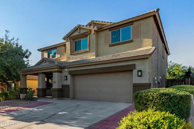 6632 W Saguaro Park Ln, Glendale, AZ 85310 - view of front of house with a garage, concrete driveway, stucco siding, and a tiled roof