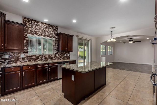 6632 W Saguaro Park Ln, Glendale, AZ 85310 - kitchen featuring dishwasher, a sink, a ceiling fan, light tile patterned floors, and recessed lighting
