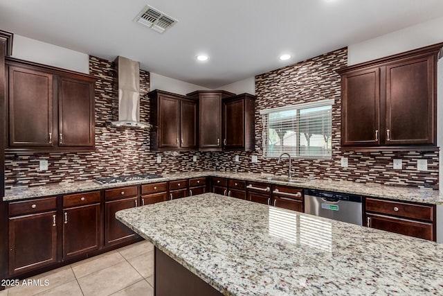 6632 W Saguaro Park Ln, Glendale, AZ 85310 - kitchen featuring appliances with stainless steel finishes, a sink, wall chimney exhaust hood, light tile patterned flooring, and decorative backsplash