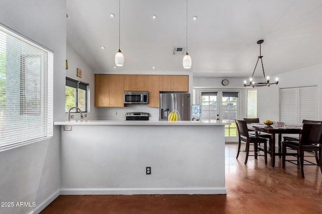 161 S Maple St, Chandler, AZ 85226 - kitchen with stainless steel appliances, concrete flooring, a peninsula, and healthy amount of natural light