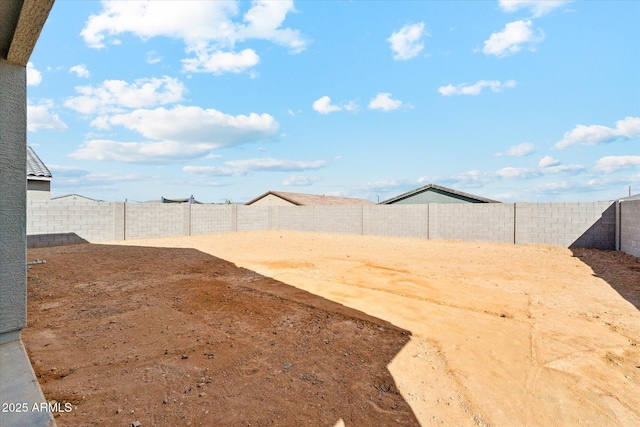 view of yard with a fenced backyard