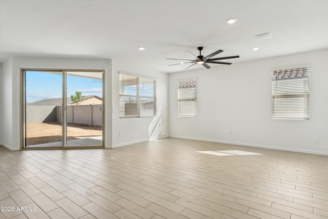 spare room featuring visible vents, baseboards, ceiling fan, light wood-style floors, and recessed lighting