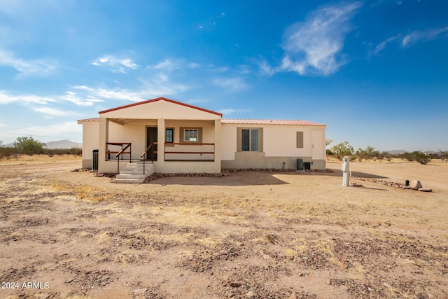 50858 W Bitter Root Rd, Maricopa, AZ 85139 - back of property featuring a porch, stucco siding, and metal roof