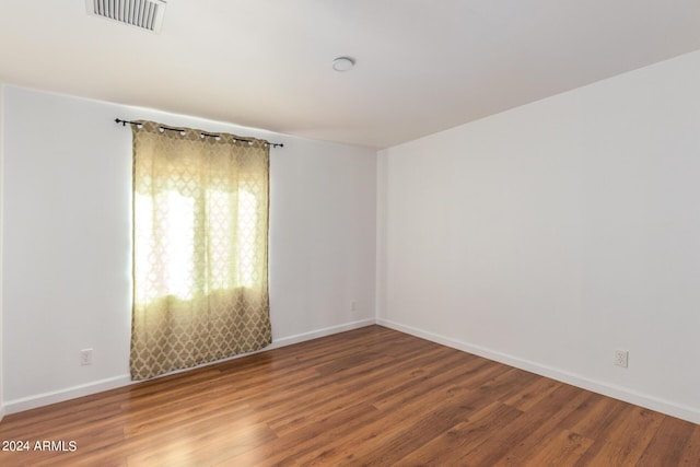 50858 W Bitter Root Rd, Maricopa, AZ 85139 - spare room with wood finished floors, baseboards, and visible vents