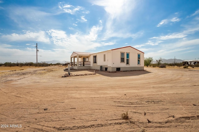 50858 W Bitter Root Rd, Maricopa, AZ 85139 - manufactured / mobile home with a mountain view and metal roof