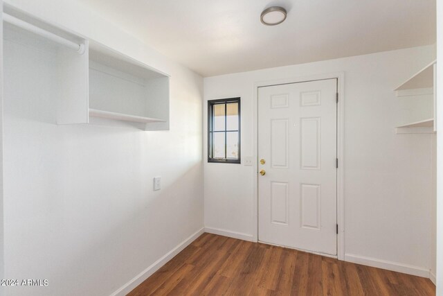 50858 W Bitter Root Rd, Maricopa, AZ 85139 - doorway featuring wood finished floors and baseboards
