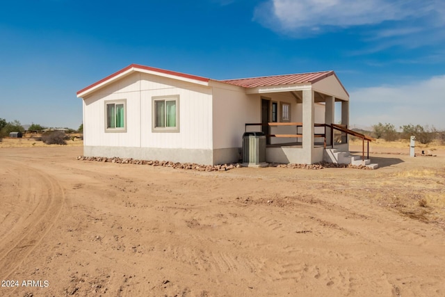 50858 W Bitter Root Rd, Maricopa, AZ 85139 - view of property exterior with metal roof