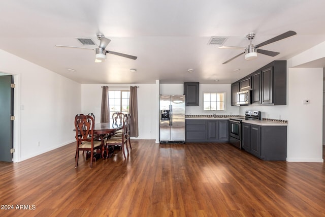 50858 W Bitter Root Rd, Maricopa, AZ 85139 - kitchen featuring dark wood finished floors, appliances with stainless steel finishes, a ceiling fan, and visible vents