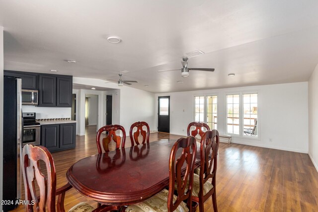 50858 W Bitter Root Rd, Maricopa, AZ 85139 - dining area featuring wood finished floors, baseboards, a ceiling fan, and visible vents