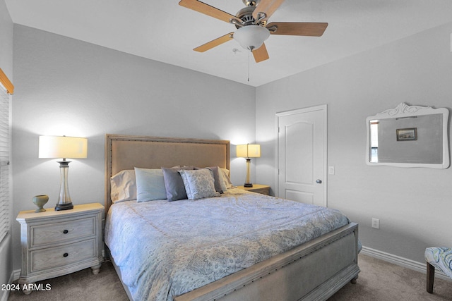 carpeted bedroom featuring ceiling fan and baseboards