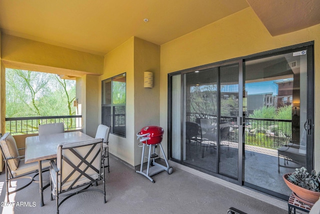 view of patio featuring outdoor dining area