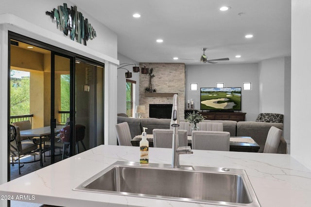 kitchen featuring open floor plan, plenty of natural light, and a sink