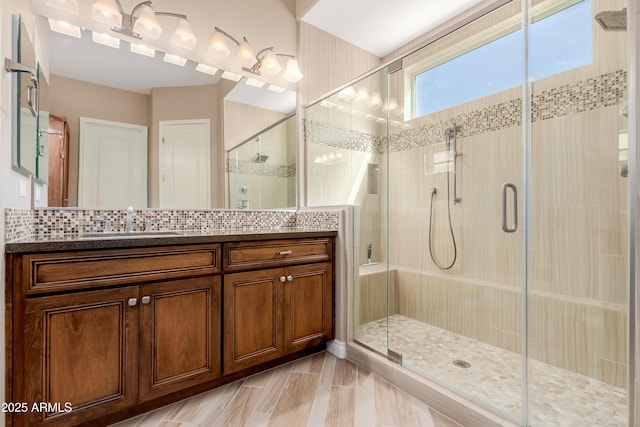 full bath featuring a stall shower and vanity