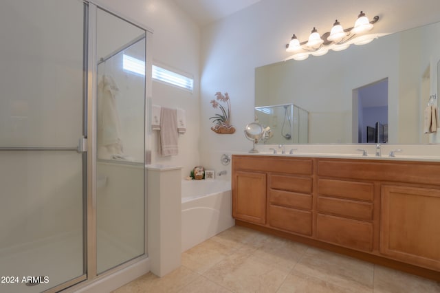 bathroom with tile patterned floors, vanity, and independent shower and bath