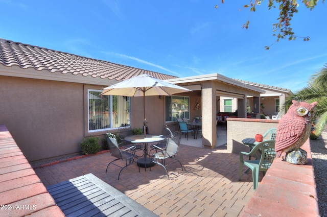 view of patio with an outdoor bar