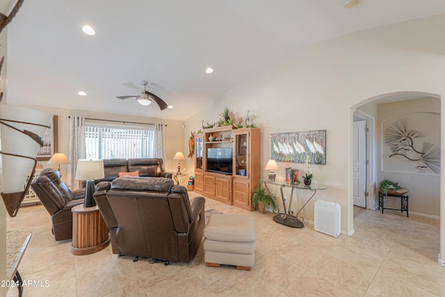 living room with ceiling fan and lofted ceiling