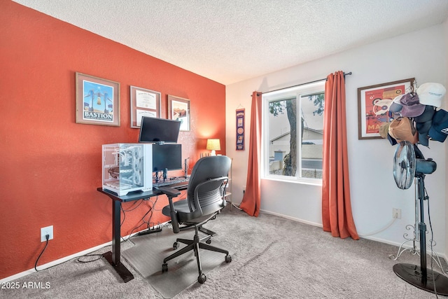 office space featuring a textured wall, a textured ceiling, baseboards, and carpet floors