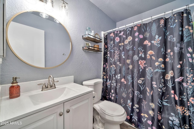 bathroom featuring a shower with curtain, toilet, vanity, and a textured wall