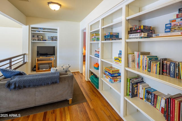 sitting room featuring wood finished floors