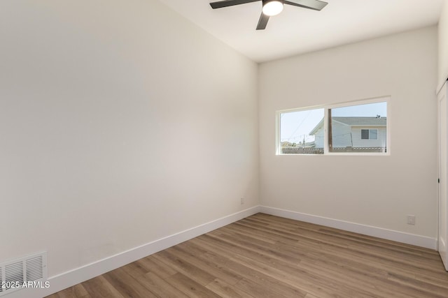 unfurnished room featuring ceiling fan, baseboards, light wood finished floors, and visible vents