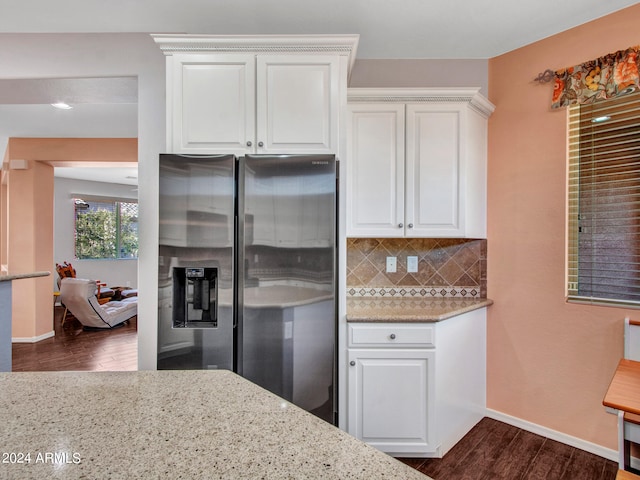 kitchen featuring white cabinets, dark hardwood / wood-style floors, stainless steel fridge with ice dispenser, and tasteful backsplash