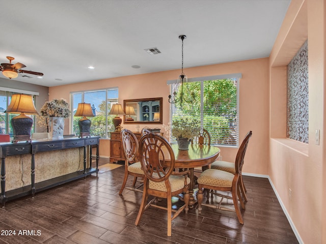 dining space featuring ceiling fan and dark wood-type flooring