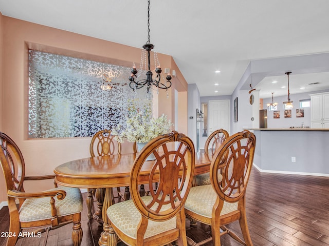 dining room featuring a notable chandelier and dark hardwood / wood-style flooring