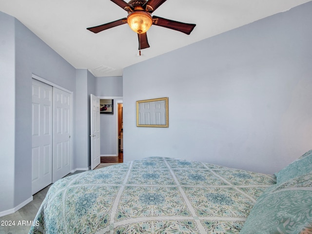 bedroom featuring ceiling fan and a closet