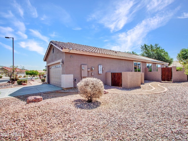 view of property exterior with a garage