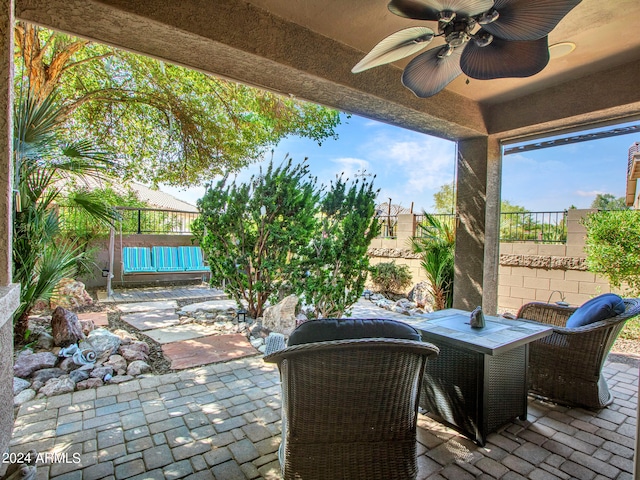 view of patio featuring ceiling fan