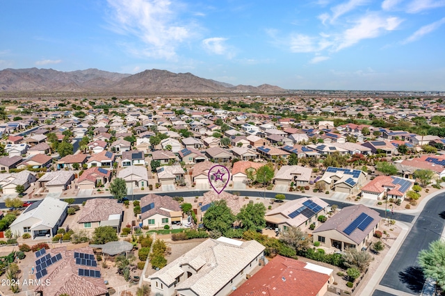 birds eye view of property featuring a mountain view