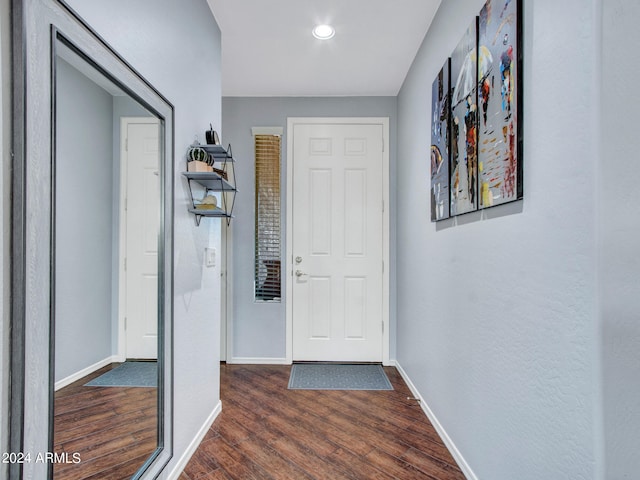 hall with dark hardwood / wood-style flooring