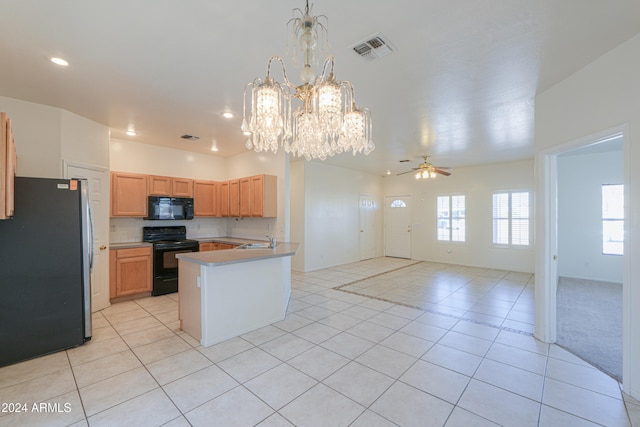 kitchen featuring black appliances, light tile patterned flooring, sink, kitchen peninsula, and ceiling fan with notable chandelier