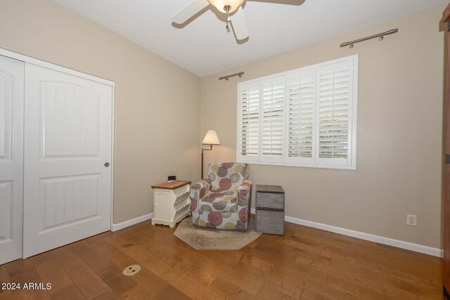 unfurnished room with ceiling fan and wood-type flooring