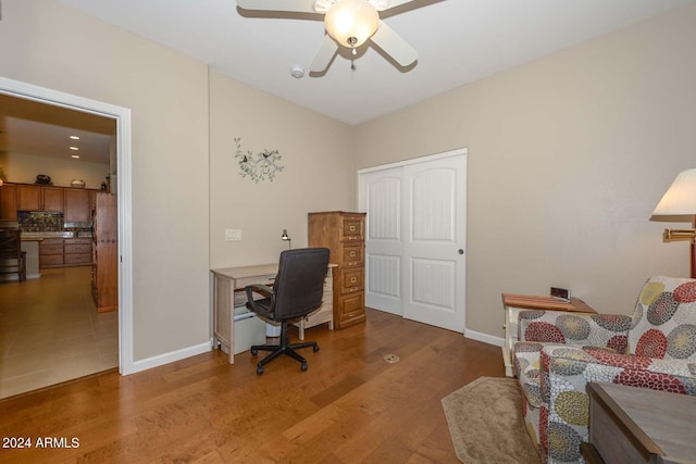 office space with hardwood / wood-style flooring and ceiling fan