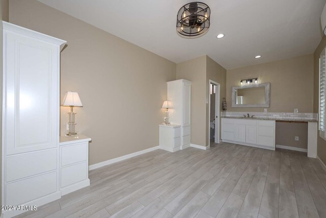 interior space featuring hardwood / wood-style floors and vanity